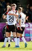 4 August 2025; Eoin Kenny of Dundalk, back, celebrates with teammates, Rohan Vaughan, 29, and John Ross Wilson after scoring his side's first goal during the SSE Airtricity Men's First Division match between Dundalk and Longford Town at Oriel Park in Dundalk, Louth. Photo by Thomas Flinkow/Sportsfile