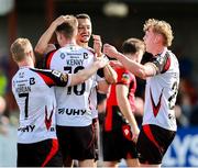 4 August 2025; Dean Ebbe of Dundalk, back, celebrates with teammates Daryl Horgan, left, Eoin Kenny, centre, and Rohan Vaughan, right, after scoring his side's second goal during the SSE Airtricity Men's First Division match between Dundalk and Longford Town at Oriel Park in Dundalk, Louth. Photo by Thomas Flinkow/Sportsfile