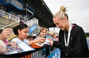 2 August 2025; Sharlene Mawdsley of Newport AC, Tipperary, signs autographs after winning the senior women's 200m during day one of the 153rd 123.ie National Track & Field Senior Championships at Morton Stadium in Dublin. Photo by Sam Barnes/Sportsfile