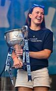 5 August 2025; Leah Caffrey holds The Brendan Martin Cup during the homecoming of TG4 All-Ireland Ladies Senior Football Champions, Dublin, at Smithfield Square in Dublin. Photo by Sam Barnes/Sportsfile