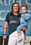 5 August 2025; Hannah Tyrrell with her daughter Aoife, age 2, during the homecoming of TG4 All-Ireland Ladies Senior Football Champions, Dublin, at Smithfield Square in Dublin. Photo by Sam Barnes/Sportsfile