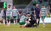 3 August 2025; Michael Noonan of Shamrock Rovers receives medical attention from Shamrock Rovers physiotherapist David White during the SSE Airtricity Men's Premier Division match between Shamrock Rovers and Derry City at Tallaght Stadium in Dublin.  Photo by Stephen McCarthy/Sportsfile