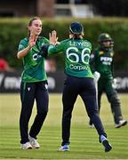 6 August 2025; Orla Prendergast of Ireland, left, celebrates with teammate Gaby Lewis after their side's victory in match one of the Women's T20 International Series between Ireland and Pakistan at Clontarf Cricket Club in Dublin. Photo by Sam Barnes/Sportsfile