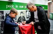 6 August 2025; Head coach Ole Gunnar Solskjaer signs an autograph for Adam McGill, son of St Patrick's Athletic kit and equipment manager David McGill, before a Besiktas media conference at Tallaght Stadium in Dublin. Photo by Stephen McCarthy/Sportsfile