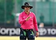 6 August 2025; Umpire Gareth Morrison signals a four during match one of the Women's T20 International Series between Ireland and Pakistan at Clontarf Cricket Club in Dublin. Photo by Sam Barnes/Sportsfile