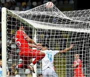 6 August 2025; Sam Bone of Shelbourne scores his side's first goal, despite the attention of Niko Jankovic of Rijeka, during the UEFA Europa League third qualifying round first leg match between Rijeka and Shelbourne at HNK Rijeka Stadium Rujevica in Rijeka, Croatia. Photo by Natasa Kupljenik/Sportsfile