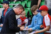 7 August 2025; St Patrick's Athletic manager Stephen Kenny with young supporters before the UEFA Conference League Third Qualifying Round first leg match between St Patrick's Athletic and Besiktas at Tallaght Stadium in Dublin. Photo by Stephen McCarthy/Sportsfile