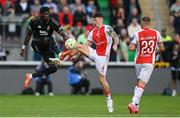 7 August 2025; Joe Redmond of St Patrick's Athletic in action against Tammy Abraham of Besiktas during the UEFA Conference League Third Qualifying Round first leg match between St Patrick's Athletic and Besiktas at Tallaght Stadium in Dublin. Photo by Stephen McCarthy/Sportsfile