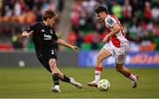 7 August 2025; Simon Power of St Patrick's Athletic in action against Jonas Svensson of Besiktas during the UEFA Conference League Third Qualifying Round first leg match between St Patrick's Athletic and Besiktas at Tallaght Stadium in Dublin. Photo by Ben McShane/Sportsfile