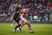 7 August 2025; Kian Leavy of St Patrick's Athletic in action against Jonas Svensson of Besiktas during the UEFA Conference League Third Qualifying Round first leg match between St Patrick's Athletic and Besiktas at Tallaght Stadium in Dublin. Photo by Ben McShane/Sportsfile