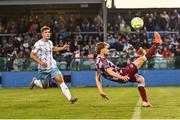 8 August 2025; Andrew Quinn of Drogheda United clears his lines as Tommy Lonergan of Waterford closes in during the SSE Airtricity Men's Premier Division match between Drogheda United and Waterford at Sullivan & Lambe Park in Drogheda, Louth. Photo by Piaras Ó Mídheach/Sportsfile