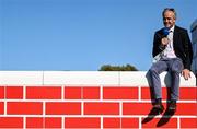 9 August 2025; Former jockey Ruby Walsh sits on the Puissance Wall during the Dublin Horse Show at the RDS Arena in Dublin. Photo by Shauna Clinton/Sportsfile