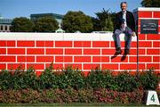 9 August 2025; Former jockey Ruby Walsh sits on the Puissance Wall during the Dublin Horse Show at the RDS Arena in Dublin. Photo by Shauna Clinton/Sportsfile