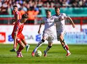 9 August 2025; Ross Tierney of Bohemians in action against Sean Moore of Shelbourne during the SSE Airtricity Men's Premier Division match between Shelbourne and Bohemians at Tolka Park in Dublin. Photo by Piaras Ó Mídheach/Sportsfile