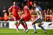 9 August 2025; Mipo Odubeko of Shelbourne in action against Leigh Kavanagh of Bohemians during the SSE Airtricity Men's Premier Division match between Shelbourne and Bohemians at Tolka Park in Dublin. Photo by Tyler Miller/Sportsfile