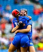 10 August 2025; Laois players Grainne Delaney and Aimee Collier celebrate after their side's victory in the Glen Dimplex All-Ireland Premier Junior Camogie Championship final match between Armagh and Laois at Croke Park in Dublin. Photo by Piaras Ó Mídheach/Sportsfile