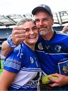10 August 2025; Laois captain Clodagh Tynan celebrates with her dad Liam after victory in the Glen Dimplex All-Ireland Premier Junior Camogie Championship final match between Armagh and Laois at Croke Park in Dublin. Photo by Piaras Ó Mídheach/Sportsfile