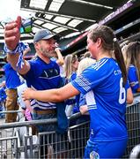10 August 2025; Laois captain Clodagh Tynan celebrates with her dad Liam after victory in the Glen Dimplex All-Ireland Premier Junior Camogie Championship final match between Armagh and Laois at Croke Park in Dublin. Photo by Piaras Ó Mídheach/Sportsfile