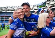 10 August 2025; Laois captain Clodagh Tynan celebrates with her dad Liam after victory in the Glen Dimplex All-Ireland Premier Junior Camogie Championship final match between Armagh and Laois at Croke Park in Dublin. Photo by Piaras Ó Mídheach/Sportsfile
