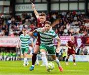 10 August 2025; Lee Grace of Shamrock Rovers is tackled by Axel Piesold of Galway United during the SSE Airtricity Men's Premier Division match between Galway United and Shamrock Rovers at Eamonn Deacy Park in Galway. Photo by Thomas Flinkow/Sportsfile