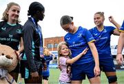 10 August 2025; Leinster players, including Ellie O'Sullivan, centre, is joined by Ellie Martin, daughter of Leinster head coach Ben Martin, after the Vodafone Women’s Interprovincial Championship Round 1 match between Leinster and Ulster at Energia Park in Dublin. Photo by Shauna Clinton/Sportsfile