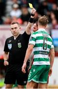 10 August 2025; Referee Kevin O'Sullivan shows a yellow card to Dan Cleary of Shamrock Rovers during the SSE Airtricity Men's Premier Division match between Galway United and Shamrock Rovers at Eamonn Deacy Park in Galway. Photo by Thomas Flinkow/Sportsfile