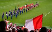 10 August 2025; The Cork and Galway teams parade behind The Artane Band before the Glen Dimplex All-Ireland Senior Camogie Championship final match between Cork and Galway at Croke Park in Dublin. Photo by Ramsey Cardy/Sportsfile