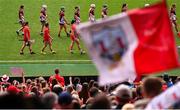 10 August 2025; The Cork and Galway teams parade behind The Artane Band before the Glen Dimplex All-Ireland Senior Camogie Championship final match between Cork and Galway at Croke Park in Dublin. Photo by Ramsey Cardy/Sportsfile