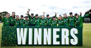 10 August 2025; Ireland players celebrate with the trophy after their side's victory in match three of the Women's T20 International Series between Ireland and Pakistan at Castle Avenue Cricket Ground in Dublin. Photo by Seb Daly/Sportsfile