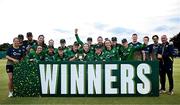 10 August 2025; Ireland players and coaches celebrate with the trophy after their side's victory in match three of the Women's T20 International Series between Ireland and Pakistan at Castle Avenue Cricket Ground in Dublin. Photo by Seb Daly/Sportsfile