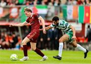 10 August 2025; David Hurley of Galway United in action against Roberto Lopes of Shamrock Rovers during the SSE Airtricity Men's Premier Division match between Galway United and Shamrock Rovers at Eamonn Deacy Park in Galway. Photo by Thomas Flinkow/Sportsfile