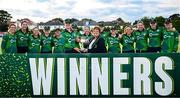 10 August 2025; Ireland captain Gaby Lewis is presented with the series trophy by Cricket Ireland president Donna Armstrong after match three of the Women's T20 International Series between Ireland and Pakistan at Castle Avenue Cricket Ground in Dublin. Photo by Seb Daly/Sportsfile