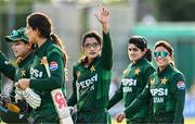 10 August 2025; Pakistan batter Muneeba Ali, centre, celebrates after scoring 100 runs match three of the Women's T20 International Series between Ireland and Pakistan at Castle Avenue Cricket Ground in Dublin. Photo by Seb Daly/Sportsfile