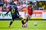10 August 2025; Luke Turner of St Patrick's Athletic in action against Owen Elding of Sligo Rovers during the SSE Airtricity Men's Premier Division match between St Patrick's Athletic and Sligo Rovers at Richmond Park in Dublin. Photo by Tyler Miller/Sportsfile