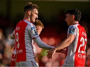 10 August 2025; Mason Melia of St Patrick's Athletic, left, celebrates with team-mate Simon Power after scoring their side's third goal during the SSE Airtricity Men's Premier Division match between St Patrick's Athletic and Sligo Rovers at Richmond Park in Dublin. Photo by Tyler Miller/Sportsfile