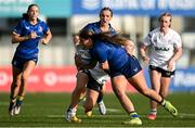 10 August 2025; Grace Cosgrove of Leinster is tackled by Méabh Hull of Ulster during the PwC U-18 Girls Interprovincial Series match between Leinster and Ulster at Energia Park in Dublin. Photo by Shauna Clinton/Sportsfile
