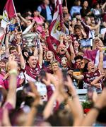 10 August 2025; Galway captain Carrie Dolan lifts the O'Duffy Cup after her side's victory in the Glen Dimplex All-Ireland Senior Camogie Championship final match between Cork and Galway at Croke Park in Dublin. Photo by Ramsey Cardy/Sportsfile