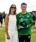 10 August 2025; Ireland's Arlene Kelly with her 50th Women's T20 International cap and partner Mikaela Shelley before match three of the Women's T20 International Series between Ireland and Pakistan at Castle Avenue Cricket Ground in Dublin. Photo by Seb Daly/Sportsfile
