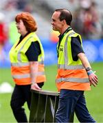 10 August 2025; Steward David Coldrick carries the bench from the team photographs before the Glen Dimplex All-Ireland Senior Camogie Championship final match between Cork and Galway at Croke Park in Dublin. Photo by Ramsey Cardy/Sportsfile