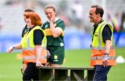 10 August 2025; Steward David Coldrick carries the bench from the team photographs before the Glen Dimplex All-Ireland Senior Camogie Championship final match between Cork and Galway at Croke Park in Dublin. Photo by Ramsey Cardy/Sportsfile