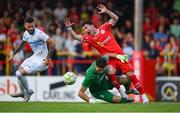 12 August 2025; Ali Coote of Shelbourne is tackled by Rijeka goalkeeper Martin Zlomislic during the UEFA Europa League Third Qualifying Round 2nd Leg match between Shelbourne and Rijeka at Tolka Park in Dublin. Photo by Stephen McCarthy/Sportsfile