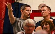 12 August 2025; Dublin gaelic footballer Stephen Cluxton, left, in conversation with Shelbourne chief executive officer Tomás Quinn during the UEFA Europa League Third Qualifying Round 2nd Leg match between Shelbourne and Rijeka at Tolka Park in Dublin. Photo by Ben McShane/Sportsfile
