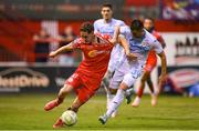 12 August 2025; John Martin of Shelbourne in action against Mladen Devetak of Rijeka during the UEFA Europa League Third Qualifying Round 2nd Leg match between Shelbourne and Rijeka at Tolka Park in Dublin. Photo by Stephen McCarthy/Sportsfile