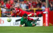 12 August 2025; Ali Coote of Shelbourne is tackled by Rijeka goalkeeper Martin Zlomislic during the UEFA Europa League Third Qualifying Round 2nd Leg match between Shelbourne and Rijeka at Tolka Park in Dublin. Photo by Stephen McCarthy/Sportsfile