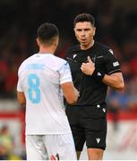 12 August 2025; Referee Marian Barbu and Dejan Petrovic of Rijeka during the UEFA Europa League Third Qualifying Round 2nd Leg match between Shelbourne and Rijeka at Tolka Park in Dublin. Photo by Stephen McCarthy/Sportsfile