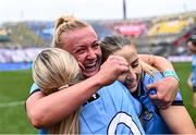3 August 2025; Dublin players Carla Rowe, centre, with team-mates Aoife Curran, left, and Rebecca McDonnell after the TG4 All-Ireland Ladies Football Senior Championship final match between Dublin and Meath at Croke Park in Dublin. Photo by Piaras Ó Mídheach/Sportsfile