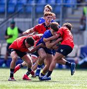 13 August 2025; Nic Sheehan of Leinster is tackled by David Nolan, left, and Liam O'Brien of Munster during the PwC U-18 Boys Interprovincial Series match between Leinster and Munster at Energia Park in Dublin. Photo by Tyler Miller/Sportsfile