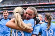 3 August 2025; Dublin players Chloe Darby and Nicole Owens, 10, after their side's victory in the TG4 All-Ireland Ladies Football Senior Championship final match between Dublin and Meath at Croke Park in Dublin. Photo by Piaras Ó Mídheach/Sportsfile