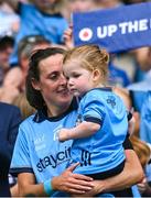 3 August 2025; Dublin footballer Hannah Tyrrell with her daughter Aoife, age 2, after the TG4 All-Ireland Ladies Football Senior Championship final match between Dublin and Meath at Croke Park in Dublin. Photo by Piaras Ó Mídheach/Sportsfile
