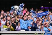 3 August 2025; Dublin footballer Hannah Tyrrell lifts the Brendan Martin Cup with her daughter Aoife, age 2, after the TG4 All-Ireland Ladies Football Senior Championship final match between Dublin and Meath at Croke Park in Dublin. Photo by Piaras Ó Mídheach/Sportsfile